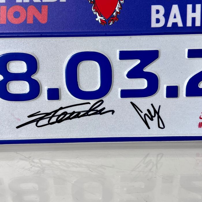 2021 Official plate of the Bahrain GP signed by Charles Leclerc and Carlos Sainz Jr